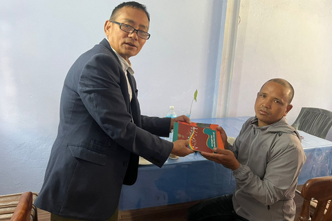 Distrubuting Tamang bhajan