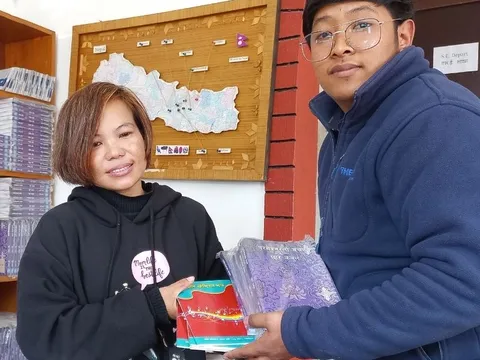 Distrubuting Tamang Tamang bhajan & Tamang Bible 